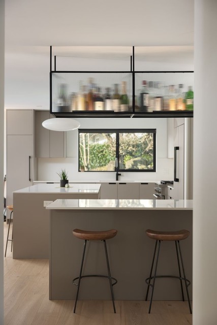 Kitchen island with hanging glass shelving