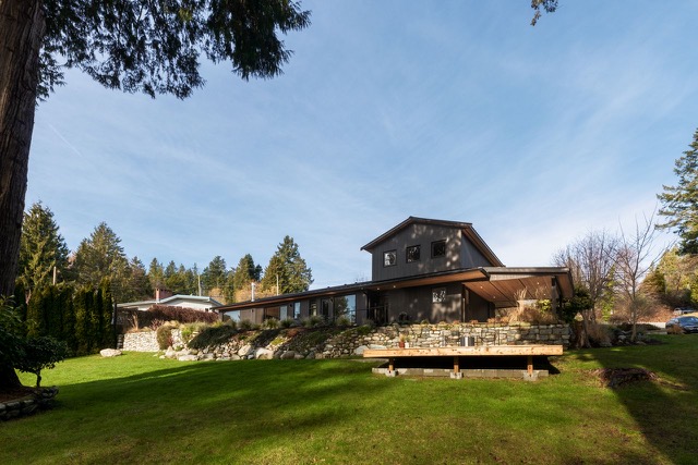 Renovated exterior across the lawn